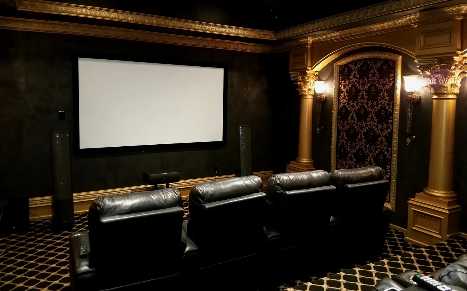 Dedicated theater system supported by Control4 and Crestron driver programming